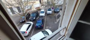 a group of cars parked in a parking lot at Studio hypercentre à 2 pas de la gare. Appart n°3 in Agen