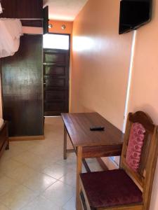 TV a/nebo společenská místnost v ubytování PRIMESHADE GUESTHOUSE