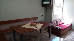 a room with a table with a bowl of fruit on it at FINCA VERDE in La Falda