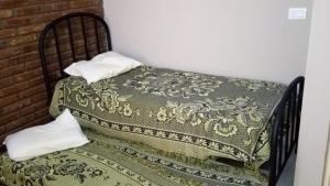 Ένα ή περισσότερα κρεβάτια σε δωμάτιο στο FINCA VERDE