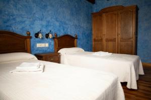 Posteľ alebo postele v izbe v ubytovaní Casa Rural La Tina