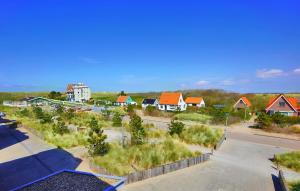 arial view of a suburb with houses and a street at Duinerei Groote Keeten in Callantsoog