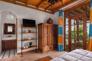 TV a/nebo společenská místnost v ubytování Eco Hotel Ixhi