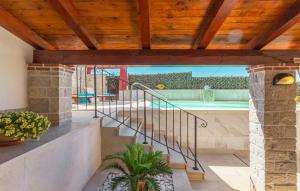 a house with a staircase and a swimming pool at Villa Marko in Buje