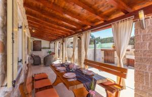 a dining room with a table and some chairs at Villa Marko in Buje