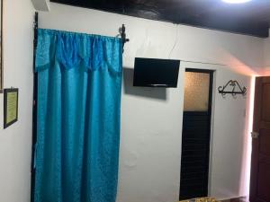 TV a/nebo společenská místnost v ubytování Hotel Clasico Colonial
