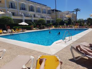 The swimming pool at or close to Aloha Gardens near Puerto Banus with breathtaking mountain view