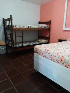
A bunk bed or bunk beds in a room at Hostel Além dos Sonhos
