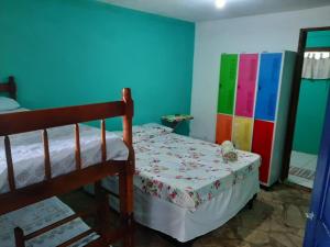 
A bed or beds in a room at Hostel Além dos Sonhos

