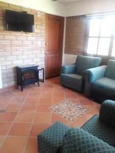 Χώρος καθιστικού στο Refugio Villa Emilio