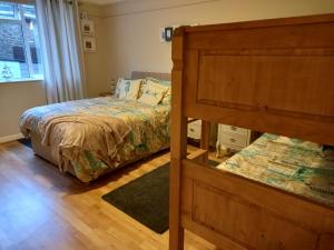 a bedroom with a bed and a dresser at 24 New Esplanade Court in Paignton