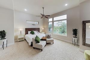 a bedroom with a bed and two chairs and a window at Washington Corridor in Houston