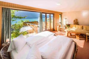 Katil atau katil-katil dalam bilik di Hotel Lindenhof by Crossworld AG