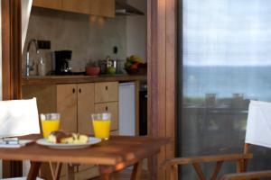 A kitchen or kitchenette at Horizonte Seafront Suites