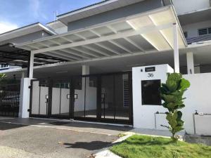 a house with a gate in front of it at Sarang Homestay - Landed House with 3 Bed Rooms in Ipoh