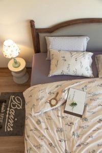 Postel nebo postele na pokoji v ubytování Hè Maison Boutique Stay & café