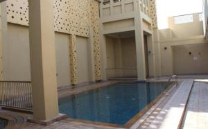 an empty swimming pool in a building at Spacious one bedroom in Al Jadaf - 5 min to metro in Dubai