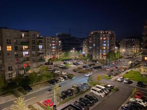 a view of a parking lot in a city at night at Smart Chic Brasov in Braşov