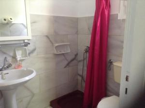 
A bathroom at Haritos Hotel - Geothermal Hot Swimming Pool
