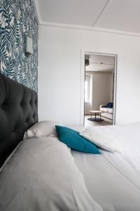 A bed or beds in a room at Contact Hôtel de Matignon