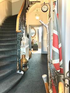 a hallway with stairs leading to a stairway at Martins Guest House in Edinburgh