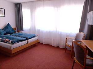 Postel nebo postele na pokoji v ubytování BodenSEE Gästehaus Tettnang ALBERGO