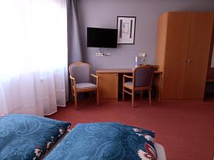 Postel nebo postele na pokoji v ubytování BodenSEE Gästehaus Tettnang ALBERGO