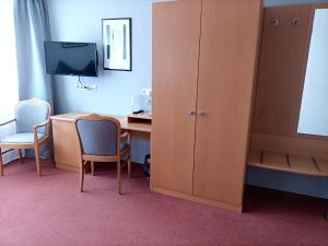 TV a/nebo společenská místnost v ubytování BodenSEE Gästehaus Tettnang ALBERGO
