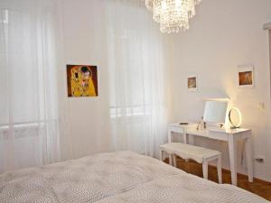 Łóżko lub łóżka w pokoju w obiekcie Ferienwohnung Klimt