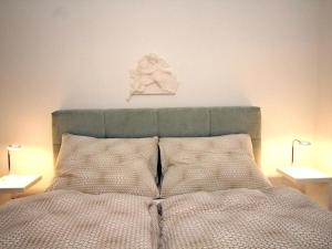 Łóżko lub łóżka w pokoju w obiekcie Ferienwohnung Klimt