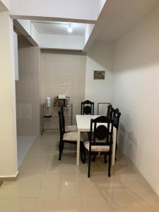 a dining room with a table and chairs at 3 bedroom Paul Meranti A303 Genting Highland Vacation Home in Genting Highlands