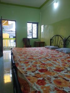Ένα ή περισσότερα κρεβάτια σε δωμάτιο στο Luiza Guest House