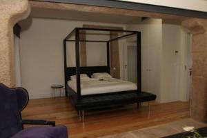 
Cama ou camas em um quarto em Solar Do Castelo

