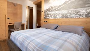 Postel nebo postele na pokoji v ubytování Hotel Compagnoni