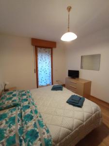 Postel nebo postele na pokoji v ubytování CASITA Locazione Turistica