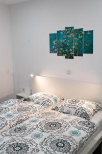 Säng eller sängar i ett rum på Apartmani Park Maksimir-Rebro