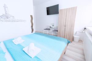 Posteľ alebo postele v izbe v ubytovaní The Dots Hostel