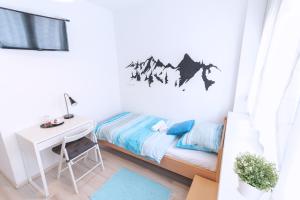 Posteľ alebo postele v izbe v ubytovaní The Dots Hostel
