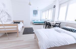 Posteľ alebo postele v izbe v ubytovaní The Dots Hostel