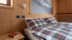 Postel nebo postele na pokoji v ubytování Hotel Compagnoni