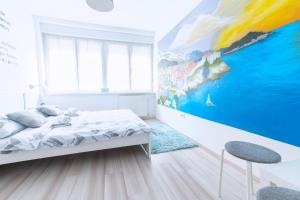 Posteľ alebo postele v izbe v ubytovaní The Dots Hostel