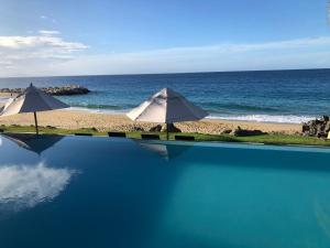 Bazén v ubytování Vacations in the Caribbean Paradise nebo v jeho okolí