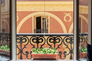 a view of a balcony with plants in a window at Homelike Sol - Gran Via I in Madrid