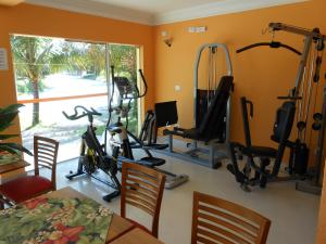 a room with a gym with tread machines at Hotel Canto da Riviera in Riviera de São Lourenço