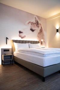 Postel nebo postele na pokoji v ubytování Adaastra Boutique Hotel