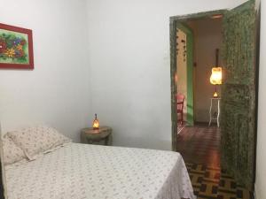 Ένα ή περισσότερα κρεβάτια σε δωμάτιο στο Gira Arte Hostel