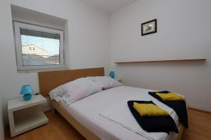 Posteľ alebo postele v izbe v ubytovaní Anamar Apartments