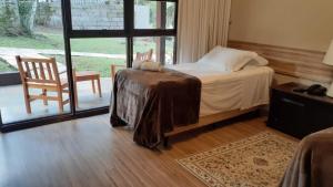 Cama ou camas em um quarto em Verona Parque Hotel
