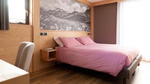 Postel nebo postele na pokoji v ubytování Hotel Compagnoni