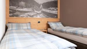 Postel nebo postele na pokoji v ubytování Hotel Compagnoni